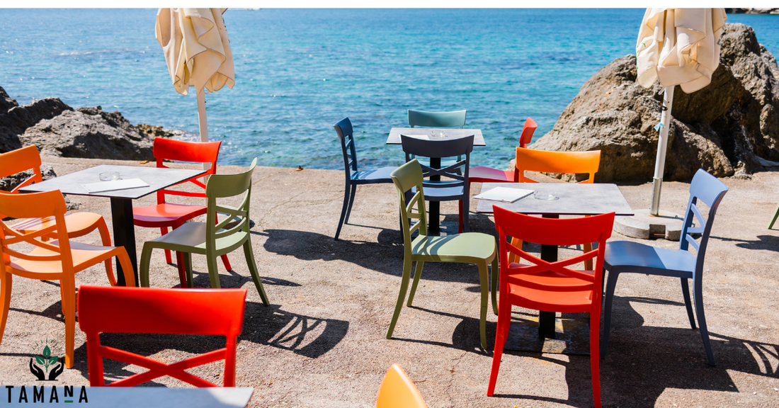 colorful red and blue cafe chairs with bluesea in the background