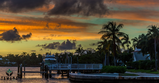 tampa private dock with yacht orange and black skies
